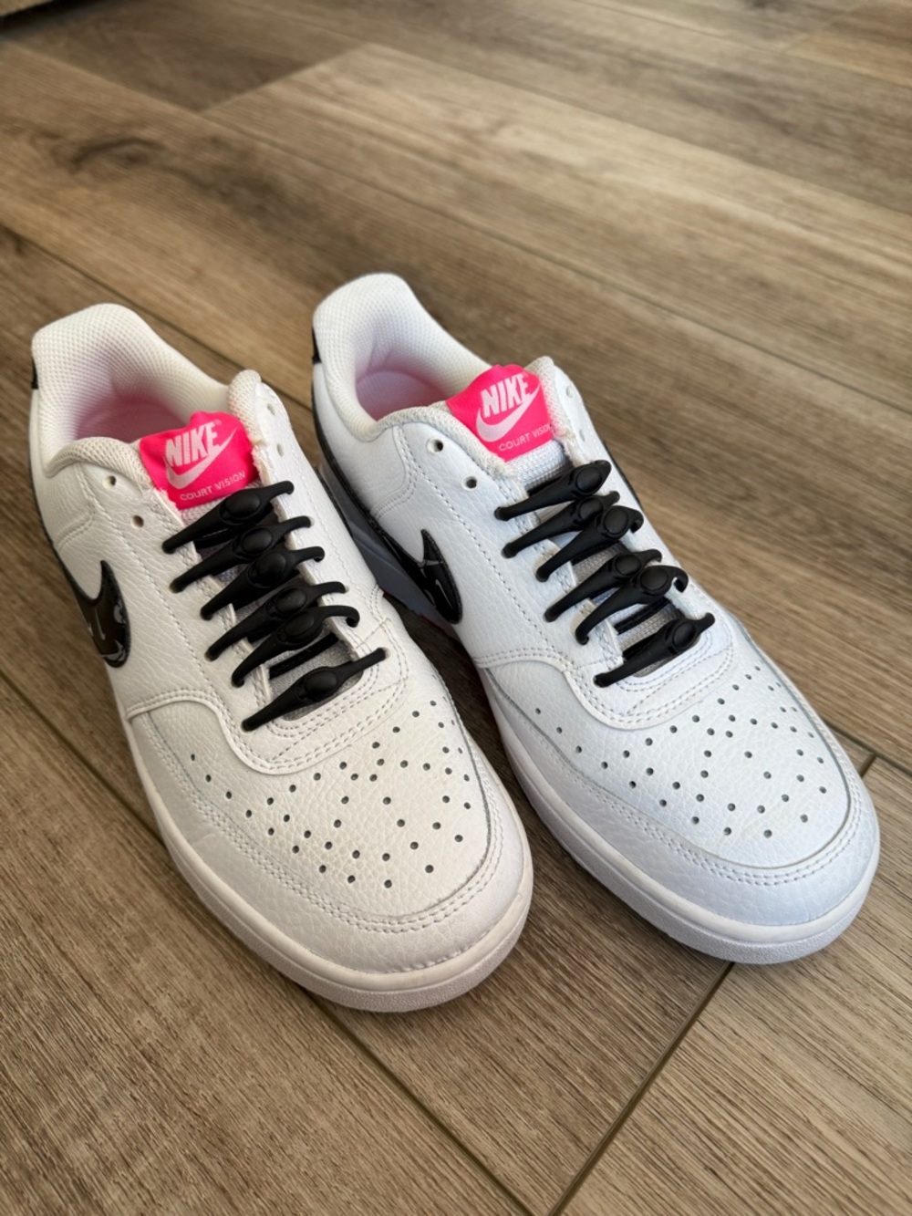 Nike White Low-Top Court Vision Sneakers with Black Swoosh and Pink Tongue
